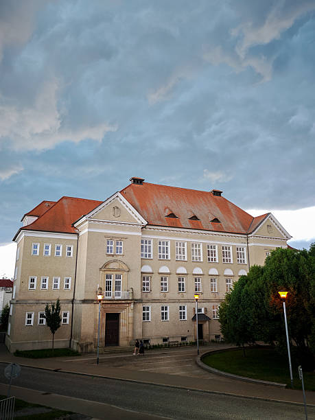 istock Historic school building with red roof and large windows 2228034096