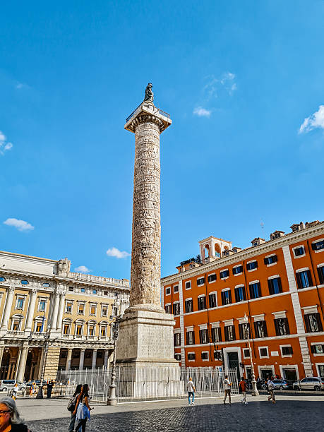 Rome, Italy - October 1, 2024 : Column of Marcus Aurelius in Piazza Colonna during the day in Rome in Italy.