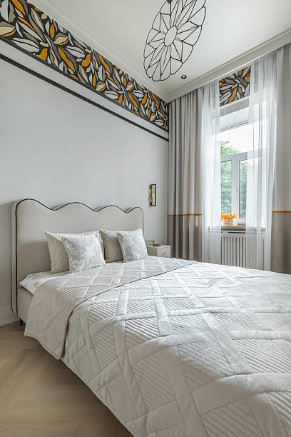istock Bright Cozy Bedroom with Modern Bed and Window 2228043237