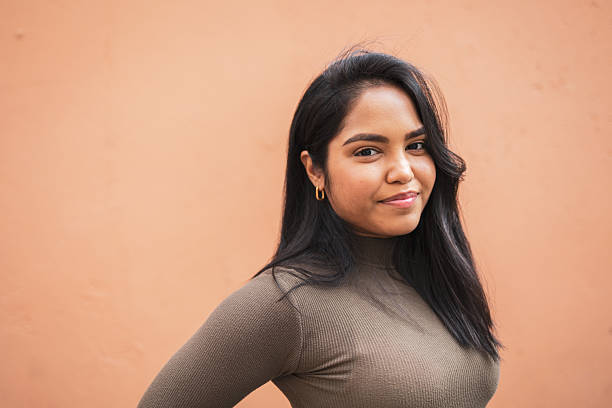 istock Portrait of a confident woman with a friendly expression on a neutral backdrop 2228044507