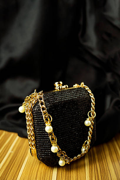 istock Luxury Black Clutch: Elegant Evening Bag with Gold Chain & Pearls 2228044853