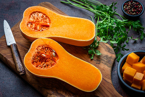 istock Halved butternut squash shot from above on kitchen table. Healthy vegetable meal or fall produce. 2228045172