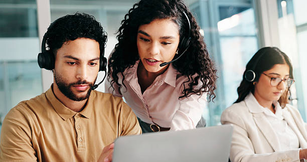 istock Laptop, call center and training team for help, technical assistance or IT advice with people. Computer, contact us and coaching intern for customer service, feedback or software support with manager 2228047112