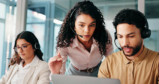 istock Computer, call center and teaching team with mentor for help, technical assistance or IT advice. Laptop, contact us and coaching intern for customer service, training or software feedback with people 2228047167