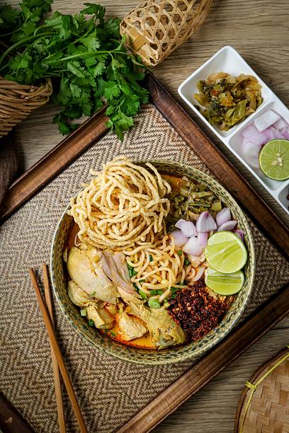 istock Northern thai curry Noodles with chicken on white background , Thai called  khao soi kai ,Northern food of thailand 2228047457