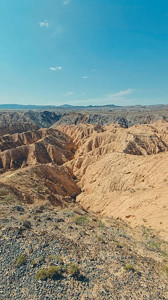 istock Sand canyon with crater-like formations 2228048450