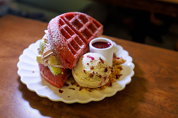 Red Velvet Waffles with Ice Cream and Rose Petal Garnish