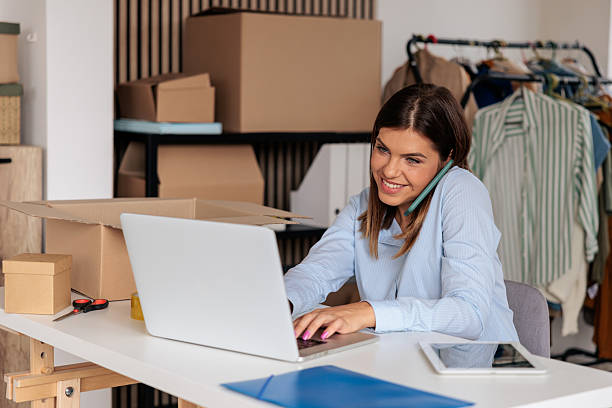 istock Female Entrepreneur Managing Orders While on a Phone Call 2228055055