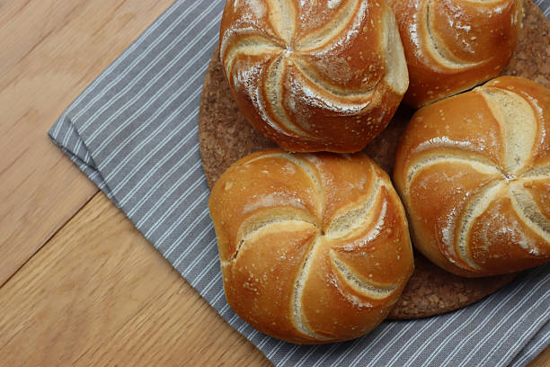 Burger bread buns in a row with sesame seeds on top.Stock photo