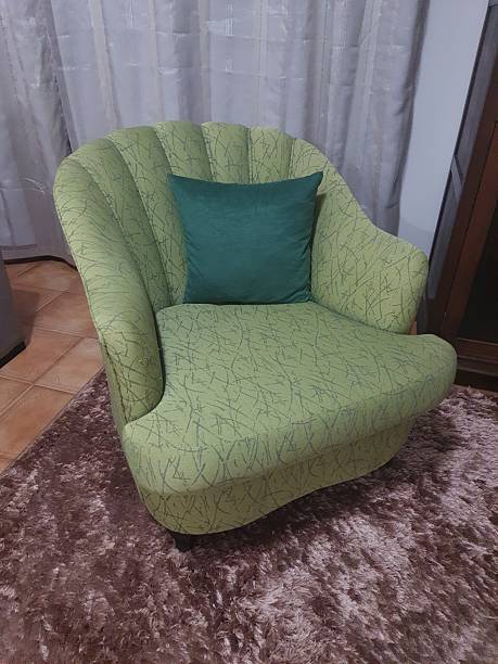 Antique armchair with green upholstery