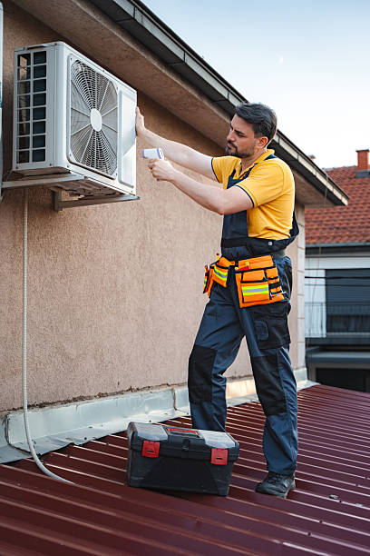istock Technician checking air conditioner with thermal imaging camera on a roof 2228065263