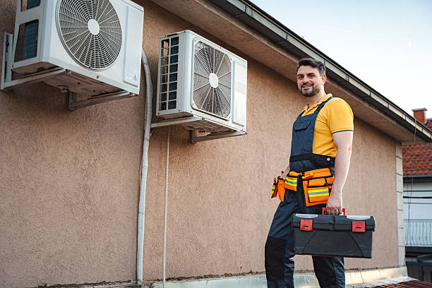 istock Technician installing air conditioners on a house wall during summer time 2228065757