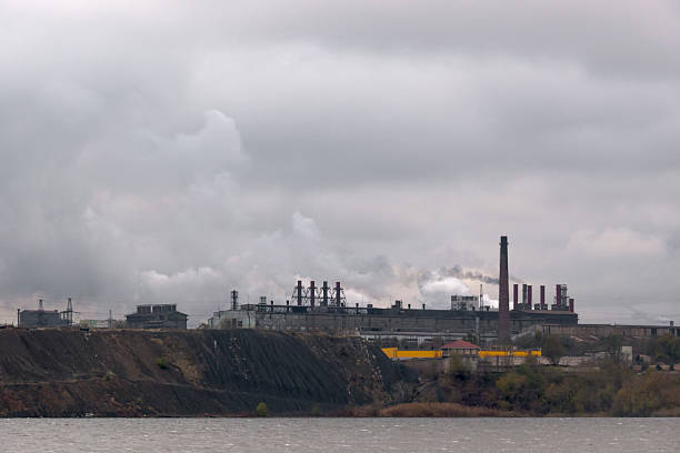 white smoke and old factory chimney