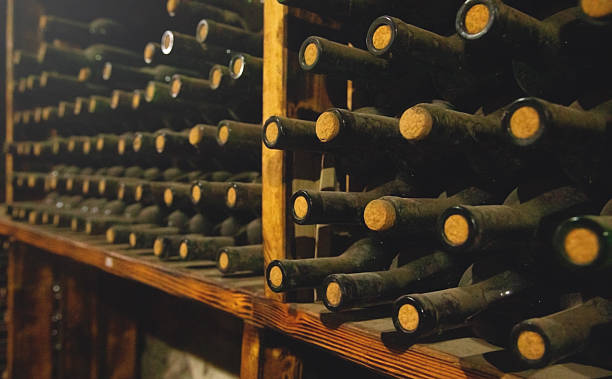 istock Wine bottles in a old warehouse. Wine storage 2228070674