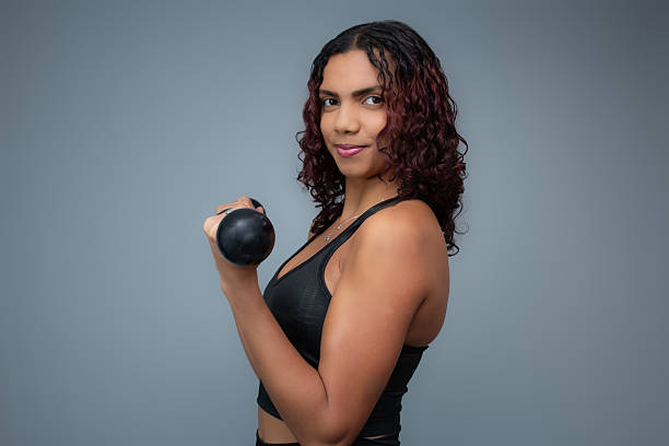 Perfect for fitness training, workout, gym, weight lifting, healthy lifestyle. Horizontal studio portrait with copy space.