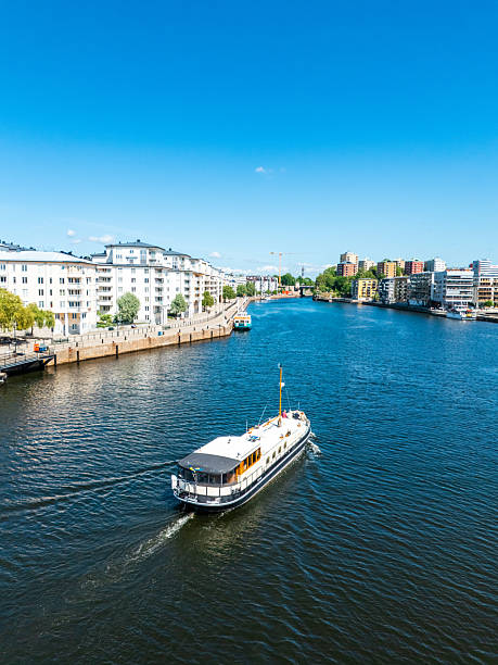 istock Ferry approaching stockholm residential waterfront on a sunny day 2228075383