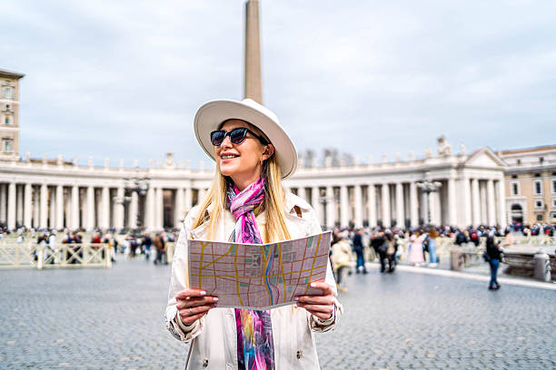 istock Woman exploring city with map in hand 2228075858