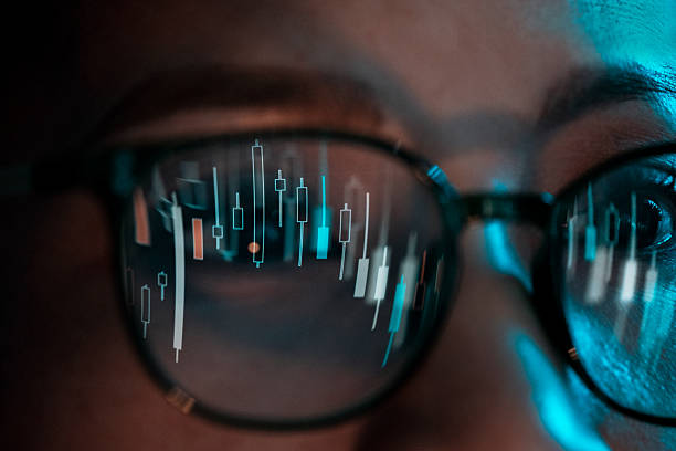 istock Stock market data reflected in eyeglasses 2228080911