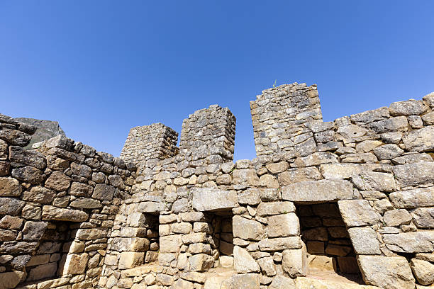 Archaeological site of Machu Picchu in Peru at daylight.Machu Picchu is a 15th-century Inca citadel located in the Eastern Cordillera of southern Peru on a mountain ridge at 2,430 meters. It is situated in the Machupicchu District of Urubamba Province about 80 km northwest of Cusco, above the Sacred Valley and along the Urubamba River, which forms a deep canyon with a subtropical mountain climate.