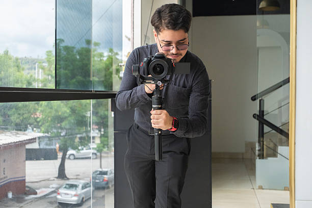 istock professional videographer performing his work with focus and precision 2228084386