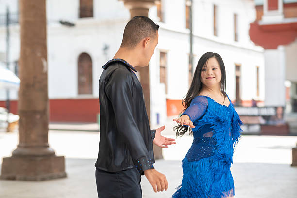 Teenagers with Down syndrome performing a choreographed dance routine.