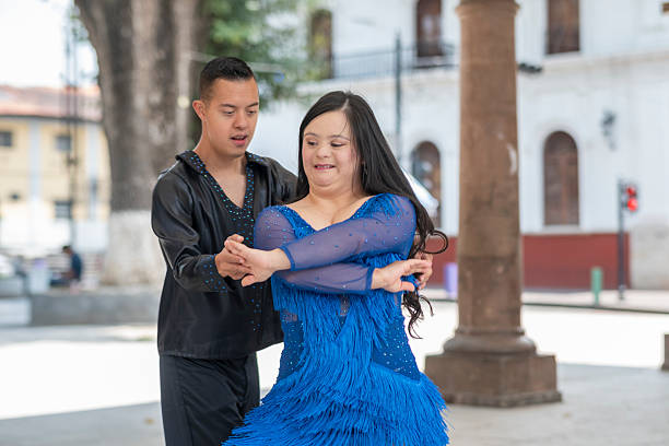 Teenagers with Down syndrome performing a choreographed dance routine.