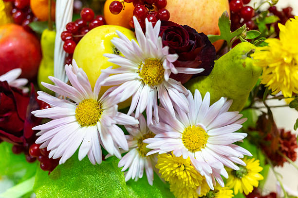 White flowers and various fruits close-up. Selective focus.
