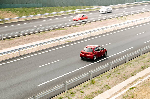 istock Cars in motion on a highway 2228092131