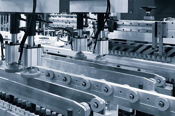 istock Crossing of the roller sawmill conveyor, Production line conveyor roller transportation objects. 2228096133