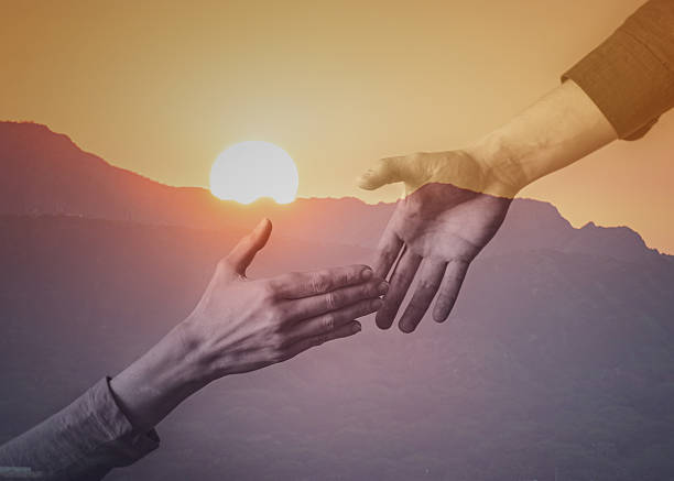 istock Men helping his hiker friend. Helping hands. 2228096830