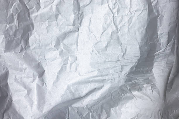Textured full frame background. Crumpled white paper.