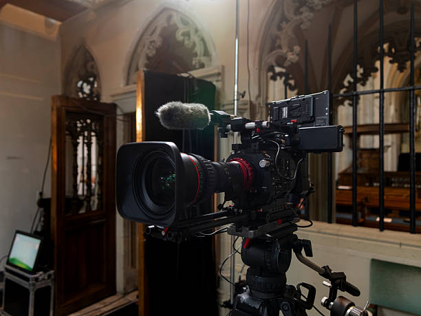 Professional video camera setup capturing content in ornate historic building with Gothic architecture