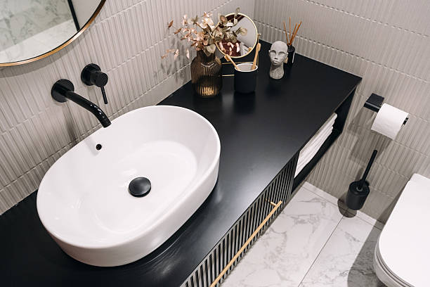 istock Sleek white bathroom sink with modern styling in an urban apartment 2228107158