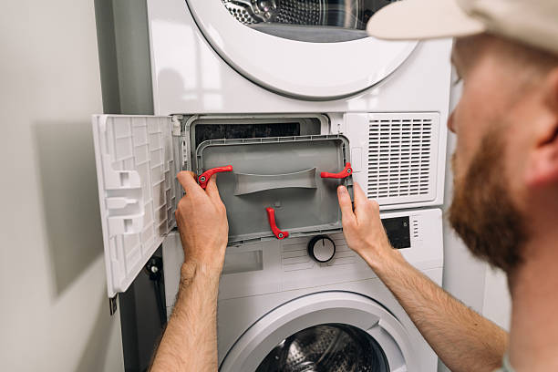 istock Repairing modern washing machine and dryer unit in a home laundry room 2228107287