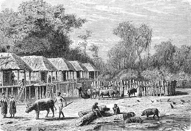 A traditional Kha ethnic minority village along the banks of the Sekong River in 19th century Siam (Thailand), showing stilt houses and riverside daily life. Old vintage illustration, 1899.