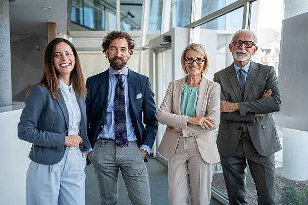 istock Successful business team smiling at camera in modern office 2228109428