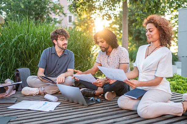 istock Diverse Executives Engage in Outdoor Meeting 2228117124
