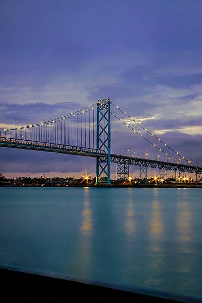 istock Suspension bridge at dusk 2228119445