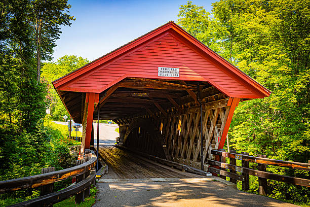 Horizontal image of the Newfield covered bridge on a clear summer day in Newfield, NY