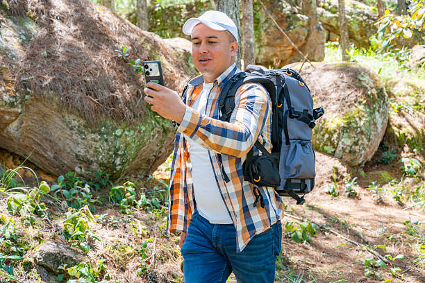 istock Hiker making a video call in the forest 2228123102