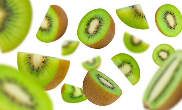 istock Floating Kiwi Slices on White Background 2228124042