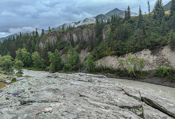 istock A beautiful view of a river flowing through a mountain valley under a cloudy sky. 2228127148