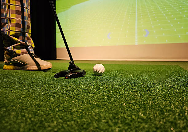 istock Indoor golf putting practice with a virtual screen display in a recreational area concept 2228129636