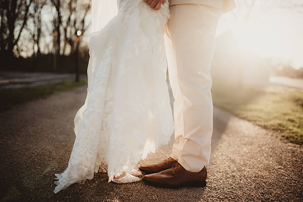 istock Bride and groom outdoors at sunset 2228133078