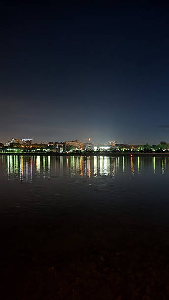 istock Bright Moon above the night city and river 2228138182