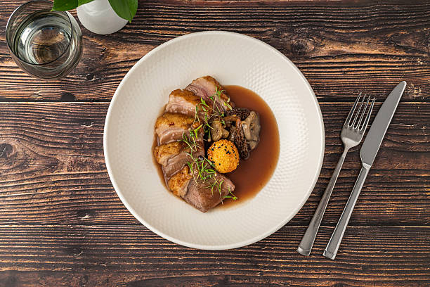 istock Sliced pan-seared duck breast with crispy skin and rich brown sauce 2228138649