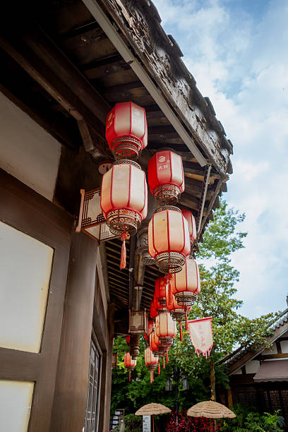 istock Traditional Red Lanterns on Wooden Building 2228139048