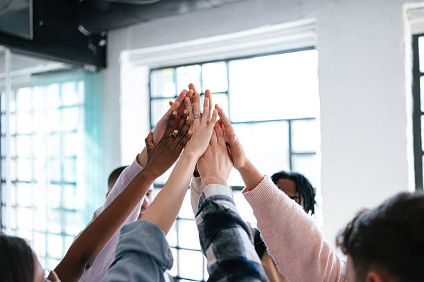 istock Group of People Showing Unity With a Symbolic High-Five Gesture 2228146084