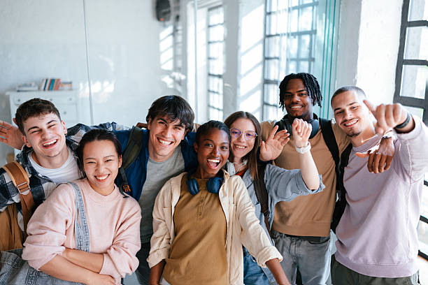 istock Group of Cheerful Students Laughing Together in a Bright Classroom 2228146090
