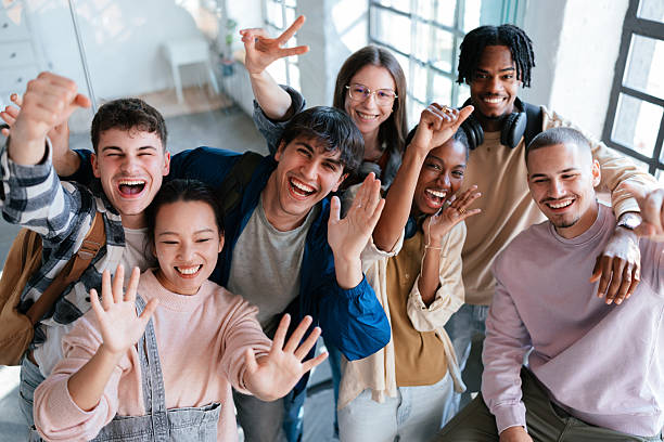 istock Diverse Group of Students Smiling and Celebrating Together in a Bright Room 2228146097